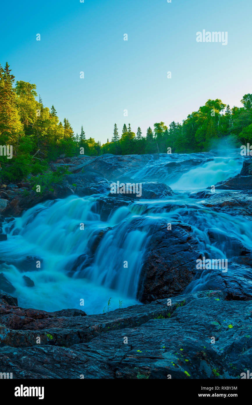 Falls at dawn on the lower Sand River, Lake Superior Provincial Park, Ontario, Canada Stock Photo