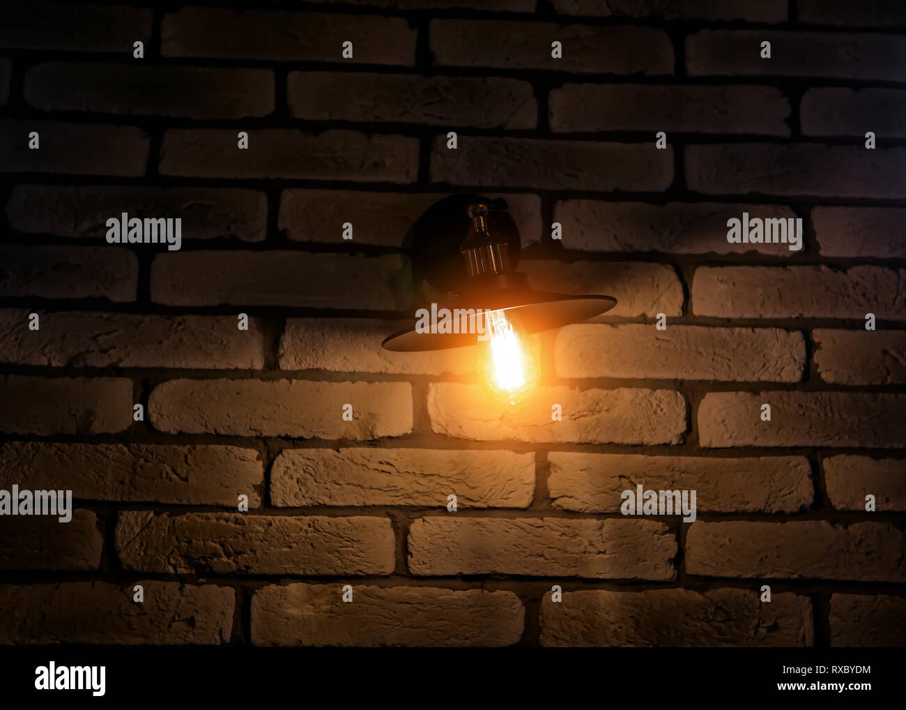 vintage lamp on brick wall background Stock Photo