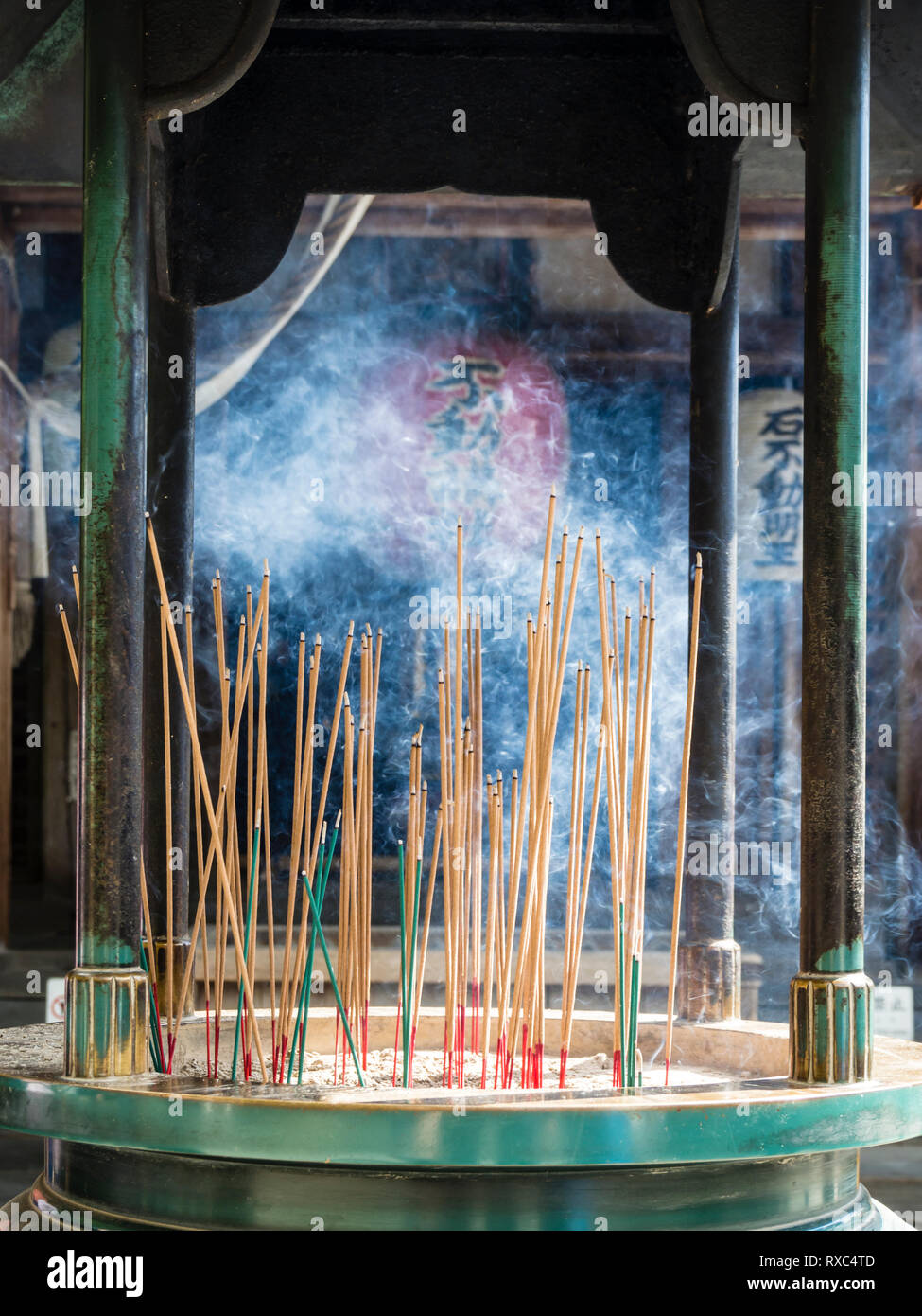 Kyoto, Japan - 14 Oct 2018: Burning incense in front of a paper lantern (Chochin) at a Buddhist shrine in Japan. Stock Photo