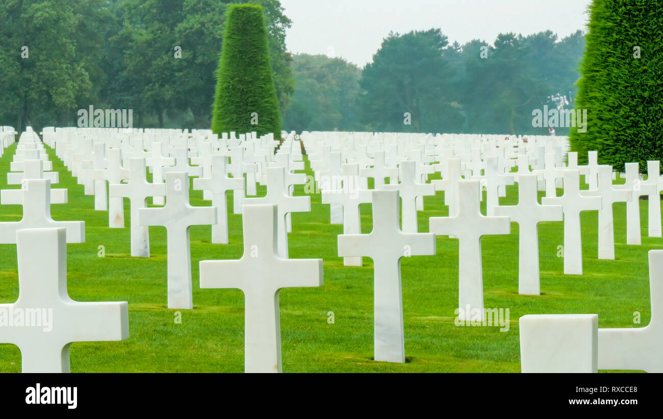 Hoeizon view of the cemetery with the crosses. The Normandy American Cemetery and Memorial is a World War II cemetery and memorial in Colleville-sur-M Stock Photo