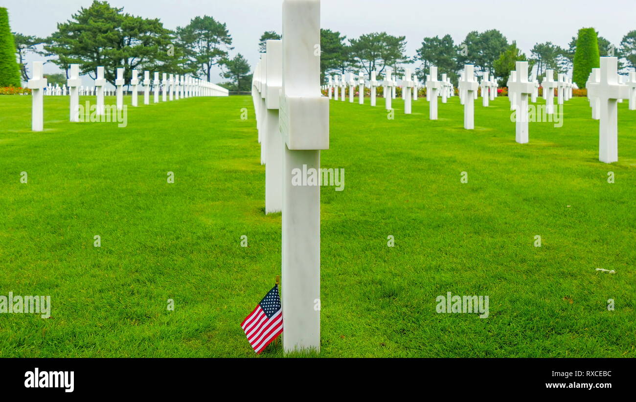 Side views of the white cross in the Normandy cemetery. The Normandy American Cemetery and Memorial is a World War II cemetery and memorial in Collevi Stock Photo