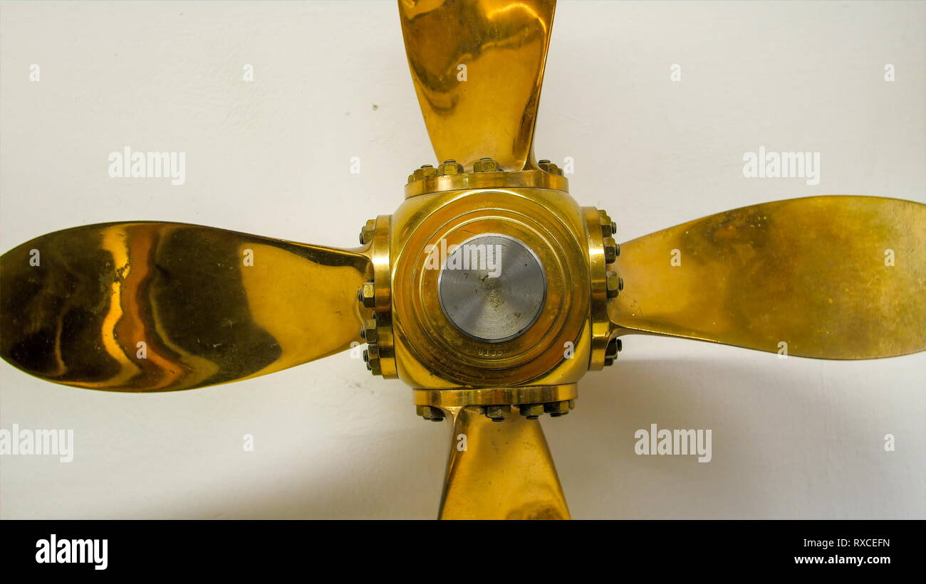 Golden propeller of a boat or ship. The propeller helps in ship