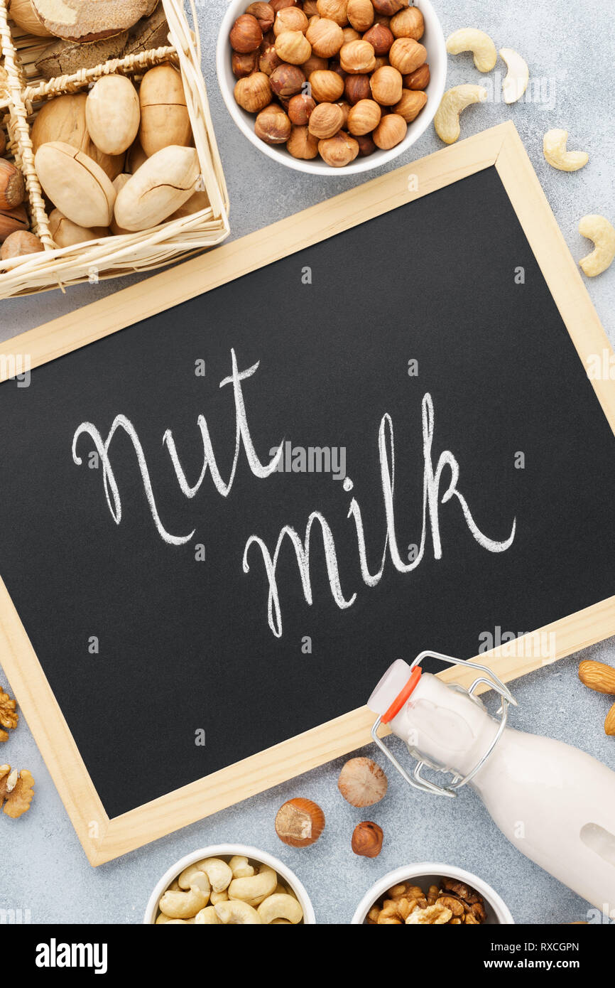 Nut milk and ingredients. Milk alternatives. Chalkboard lettering