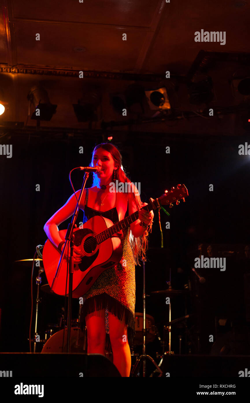 acoustic guitar player on stage