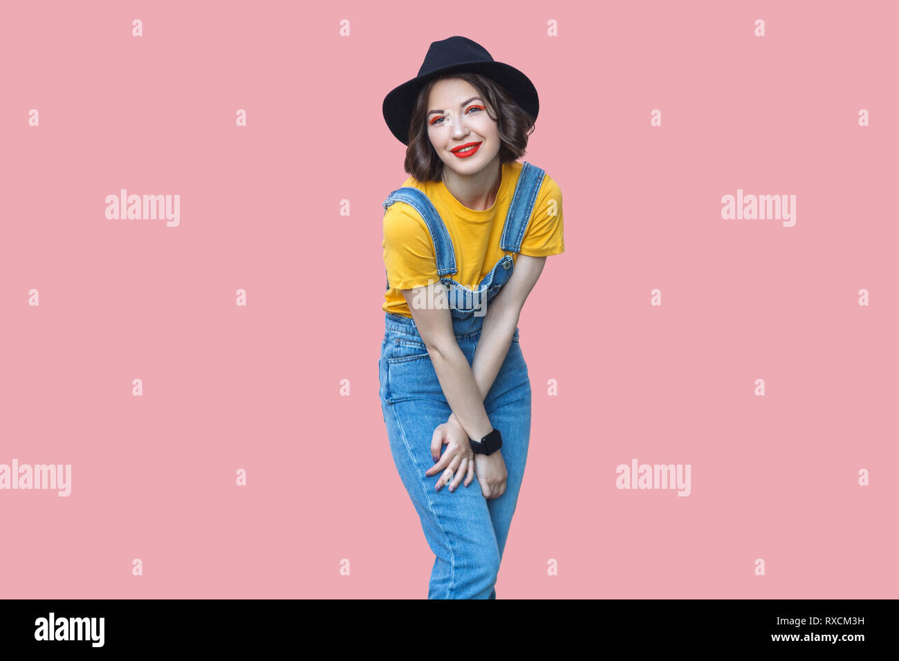 yellow baggy overalls