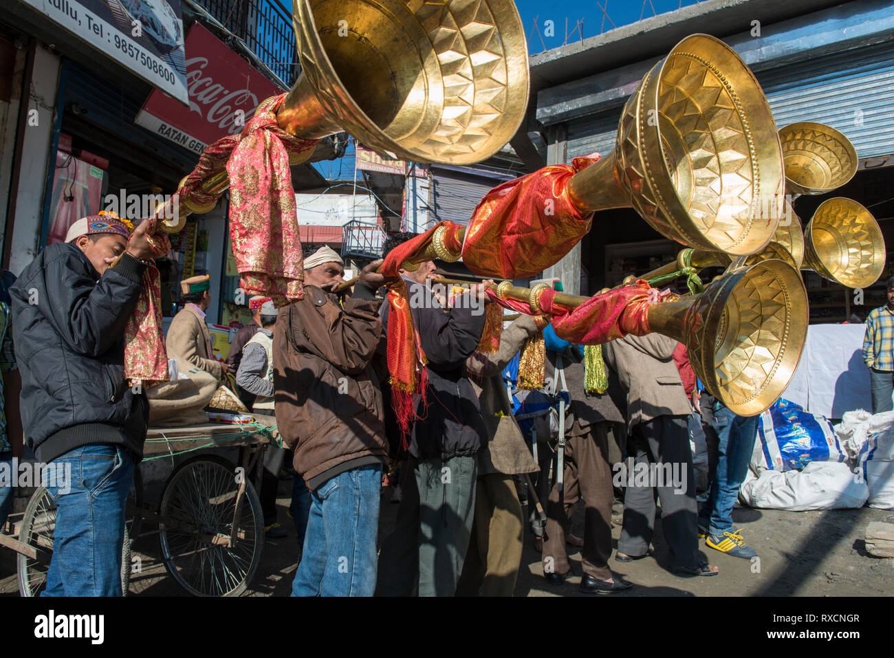 INDIA; KULLU, Musicians blowing a big trumpet during the annual Dusshera-festival in Kullu, a valley in northern India Stock Photo