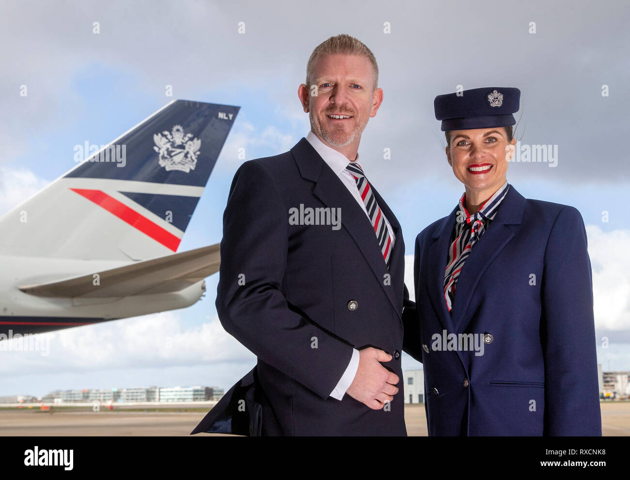 Derek Tennant (left) and Stephanie Jones stand in front of a Boeing 747 in  British Airways Landor livery, part of British Airways' centenary fleet,  which arrived at London's Heathrow Airport Stock Photo -