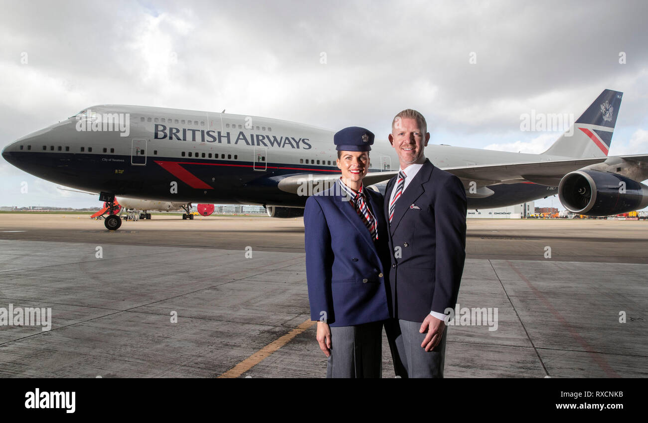 Derek Tennant (right) and Stephanie Jones stand in front of a Boeing 747 in  British Airways Landor livery, part of British Airways' centenary fleet,  which arrived at London's Heathrow Airport Stock Photo -