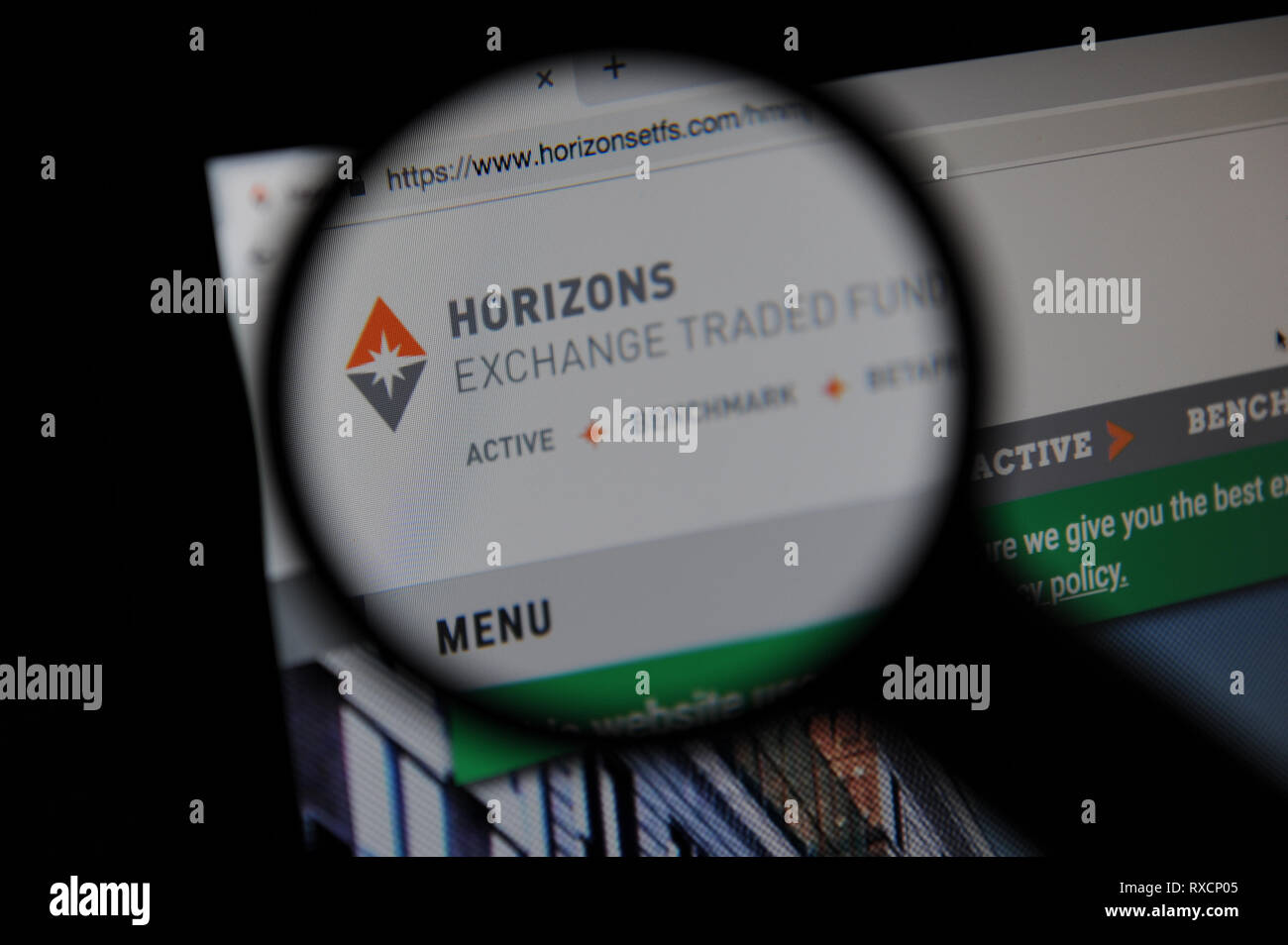 Horizons ETFs,  Horizons Exchange Traded Funds website seen through a magnifying glass Stock Photo