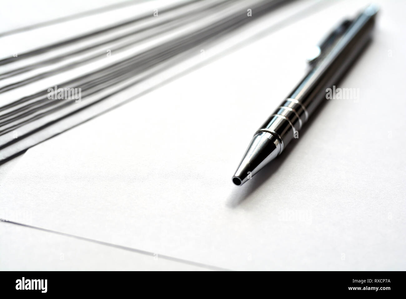 blank white paper and a pen Stock Photo