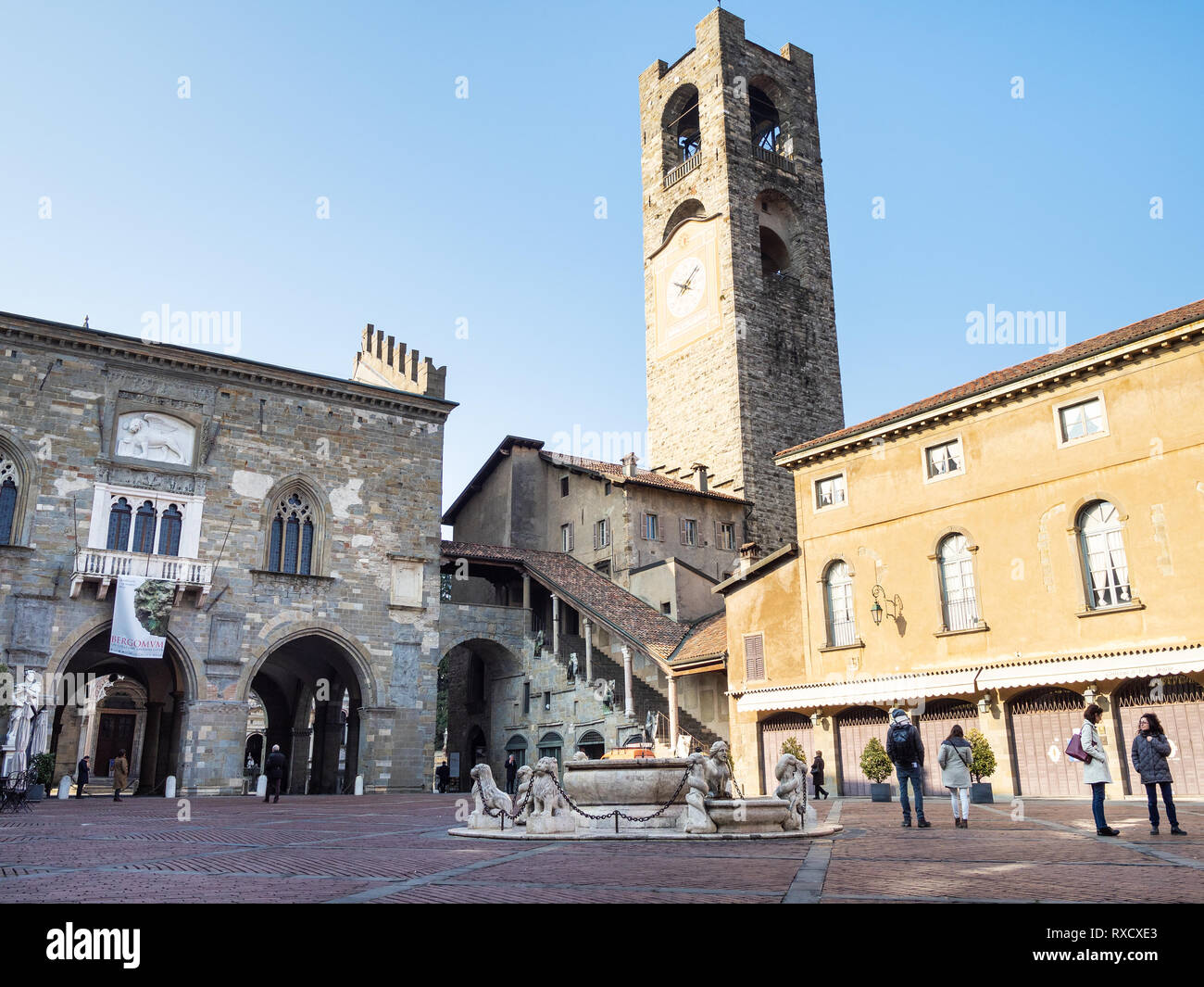 BERGAMO, ITALY - FEBRUARY 19, 2019: visitors on Piazza Vecchia square near  palaces of Palazzo della Ragione and Palazzo del Podesta in Citta Alta (Upp  Stock Photo - Alamy