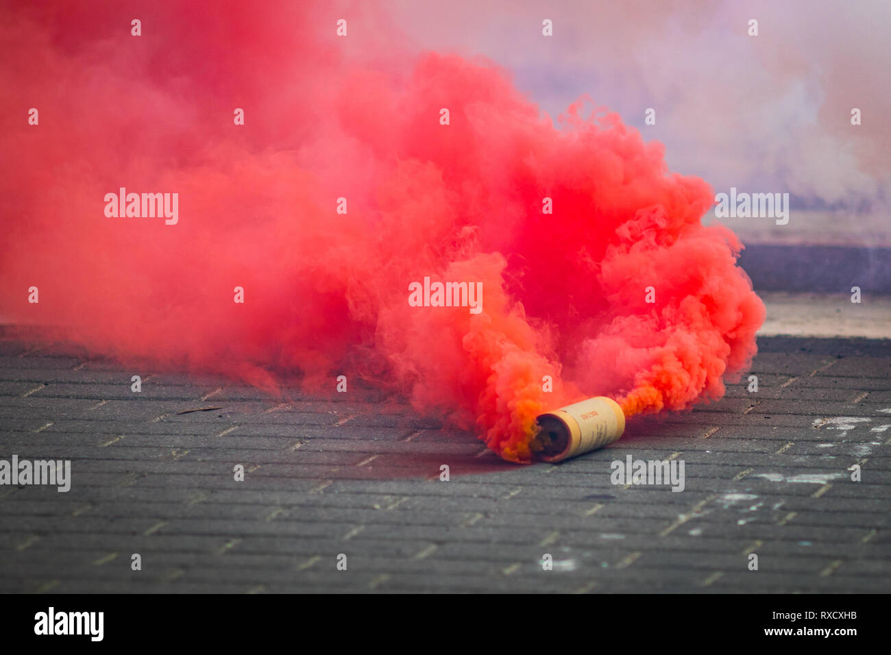 Red Smoke Bomb Stock Photo - Alamy