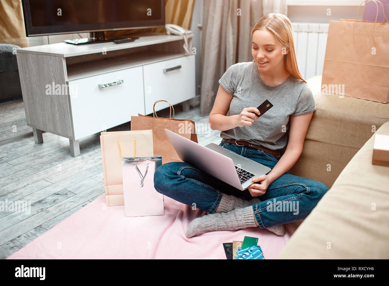 Online Shopping At Home Young Happy Woman Is Holding Credit Card