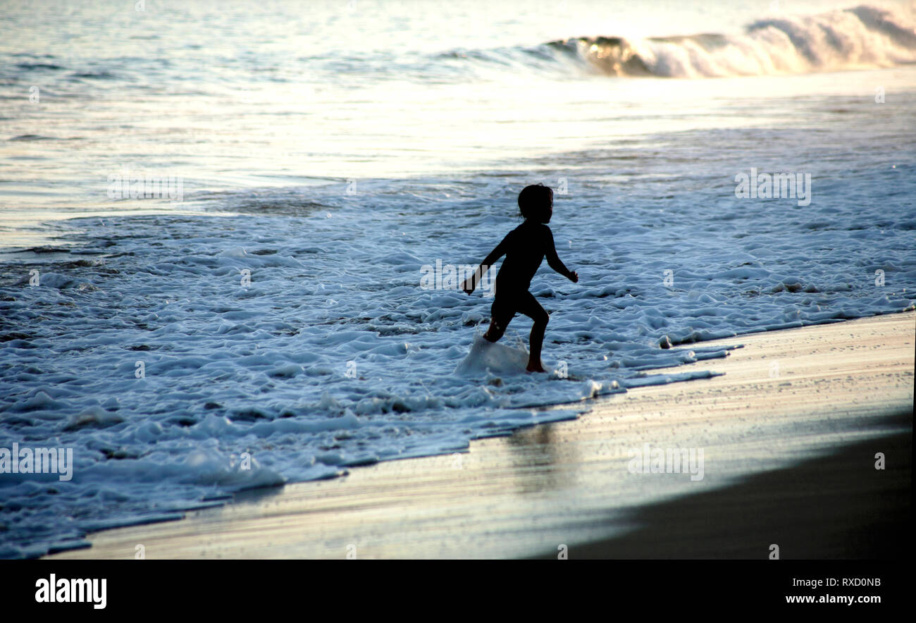 A girl run in a beach in San Jose del Cabo, Baja California, Mexico Stock Photo
