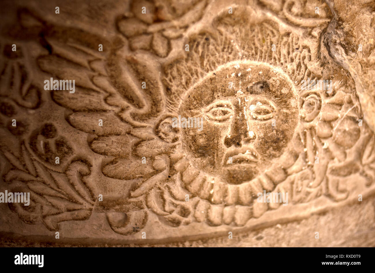 A sun carved on a stone decorates a church in Oaxaca, Mexico Stock Photo