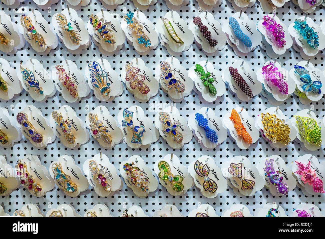 Wall display of colourful hair clips for sale, Little India Singapore Stock Photo