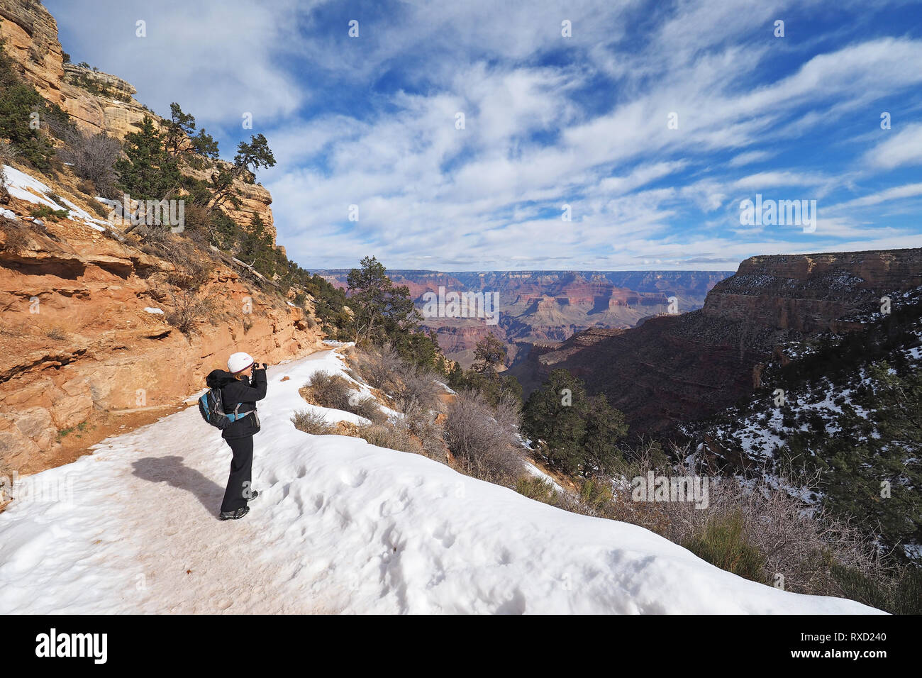 Woman hiking on a snowy Bright Angel Trail in Grand Canyon National Park Arizona in winter Stock Photo Alamy
