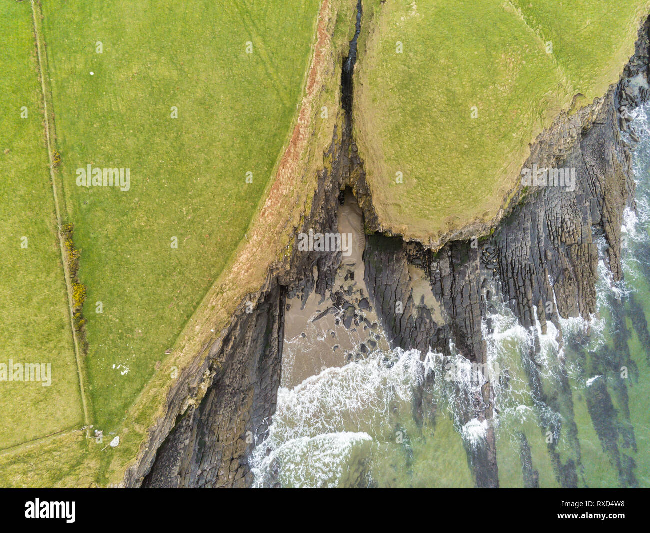 This is an aerial picture of the entrance to a sea cave on the Donegal coast of Ireland Stock Photo