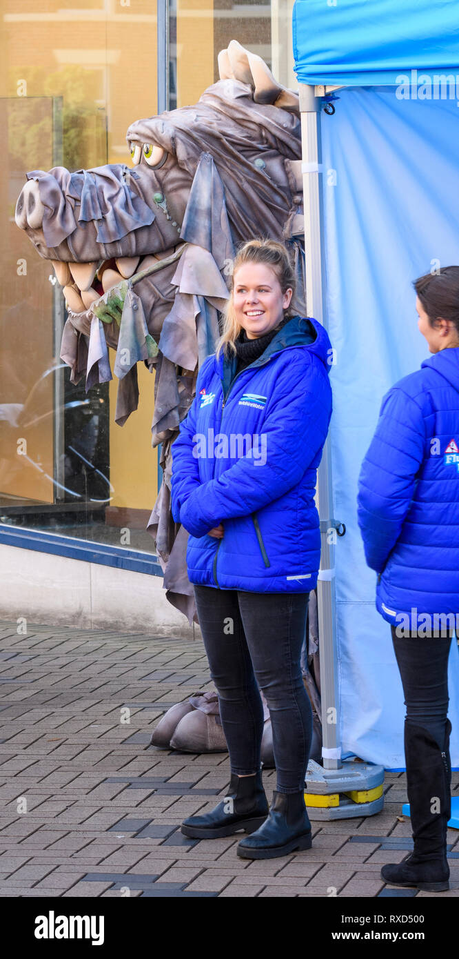 Employees of Yorkshire Water by trade stand promoting sewer blockages campaign & giant monster mascot - Wakefield Food, Drink & Rhubarb Festival 2019 Stock Photo