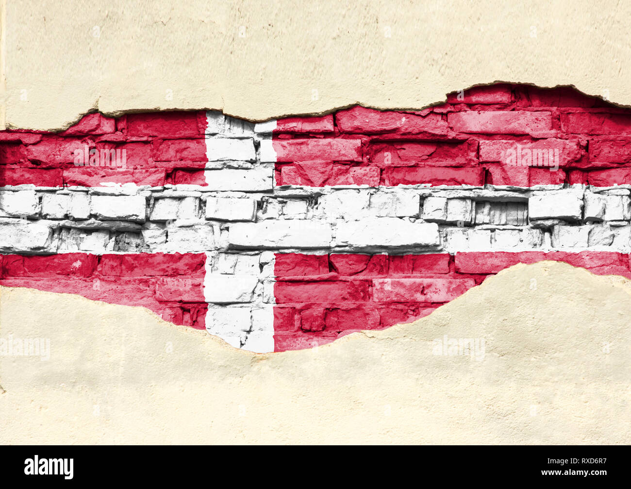 National flag of Denmark on a brick background. Brick wall with ...