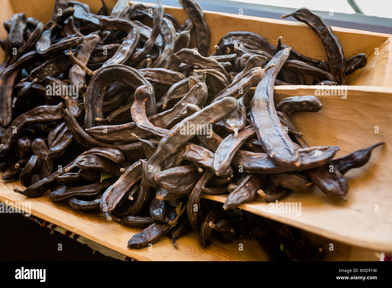 Dried carob on local market in Paphos. Traditional cypriot food on