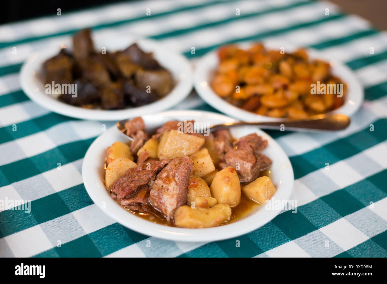 Food selection of bean, pork, liver and potato in local restaurant in Larnaca. Traditional cypriot meze food on Cyprus island. Stock Photo