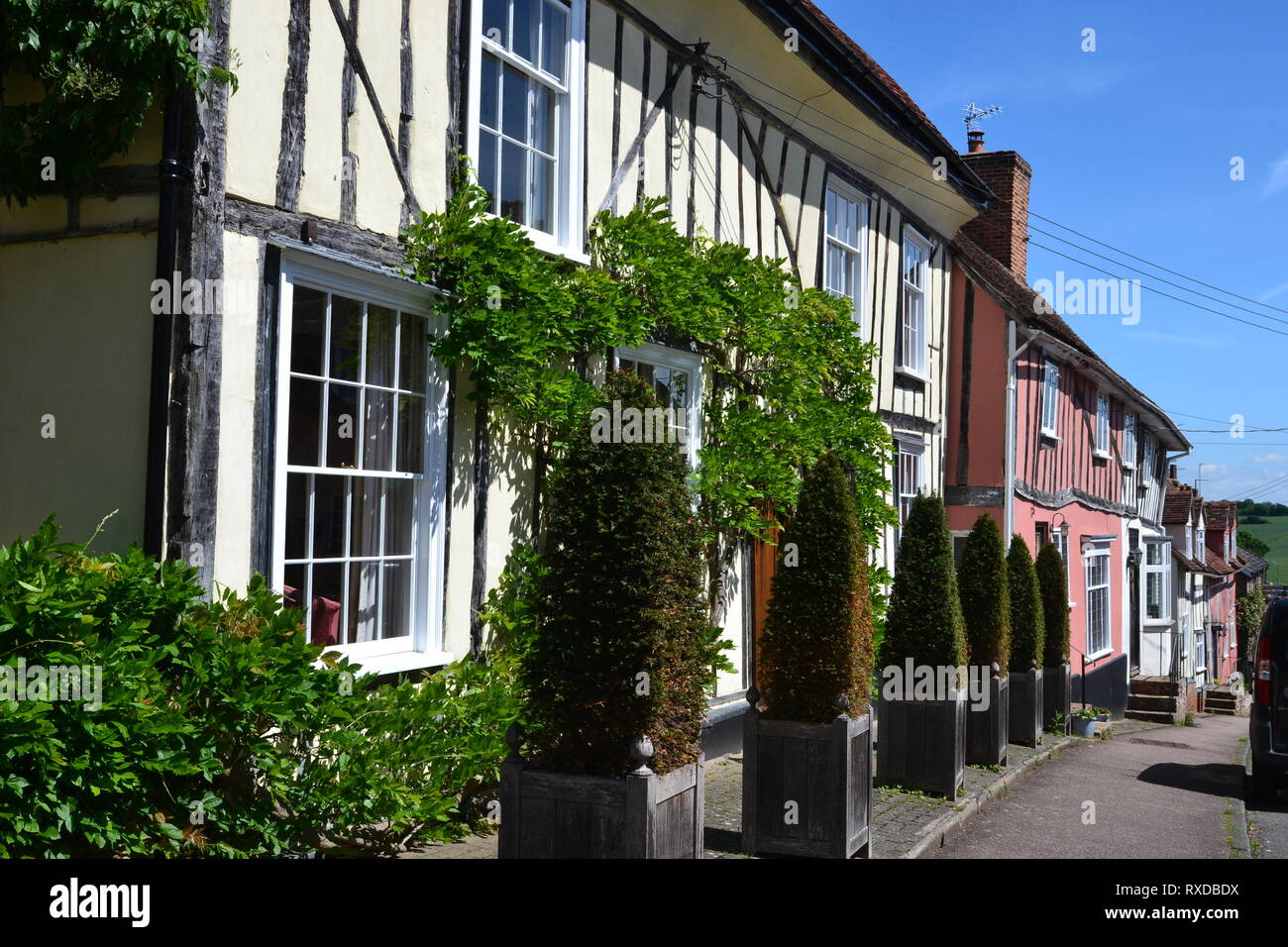 Historic Tudor half-timbered buildings in Lavenham, Suffolk, UK. Sunny day. Stock Photo