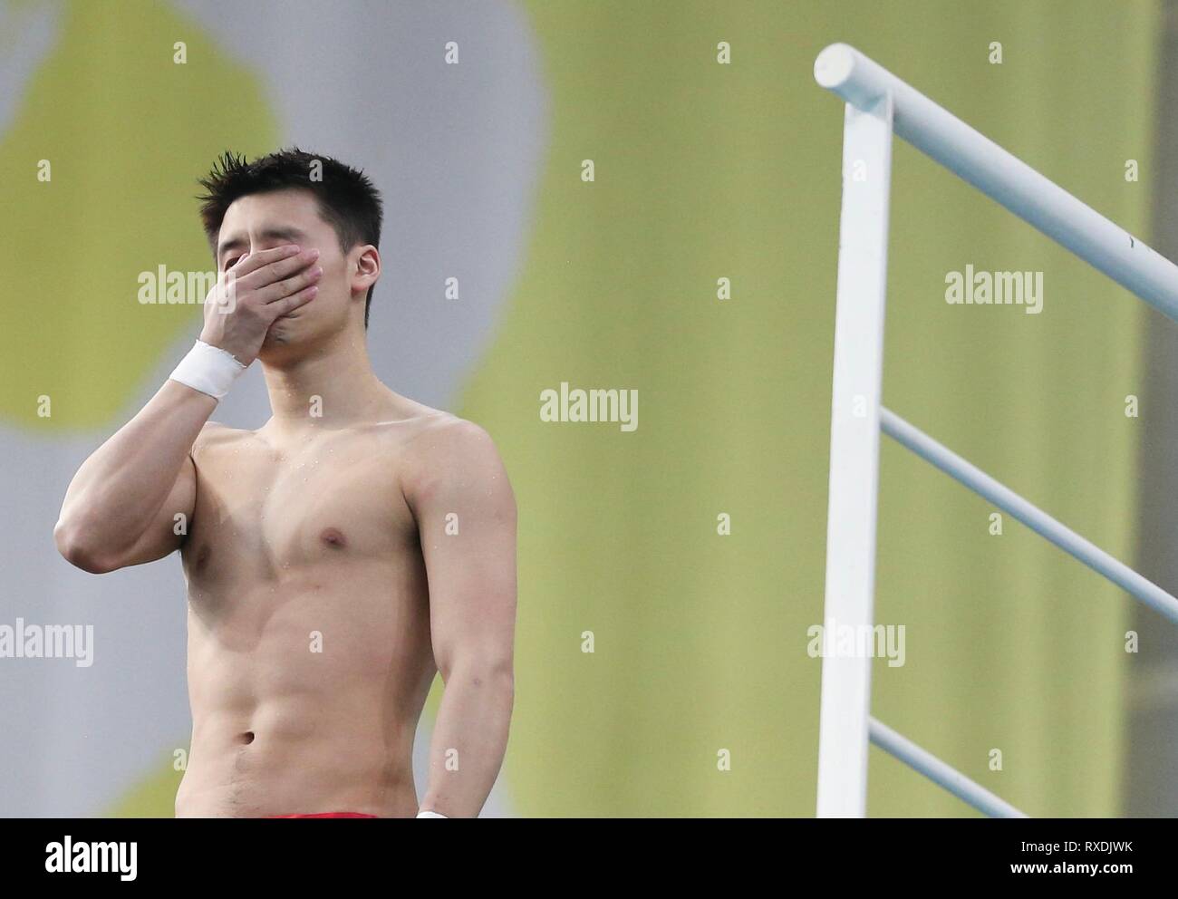 Beijing, China. 9th Mar, 2019. Chen Aisen of China reacts during the men's 10m platform final at the FINA Diving World Series 2019 at the National Aquatics Center in Beijing, capital of China, March 9, 2019. Credit: Jia Haocheng/Xinhua/Alamy Live News Stock Photo