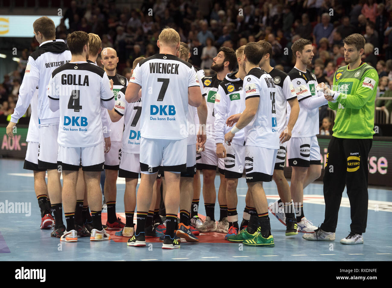 09 March 2019, North Rhine-Westphalia, Düsseldorf: Handball: International match, Germany - Switzerland in the ISS Dome. Germany's players are on the court after the 27:29 defeat against Switzerland. Photo: Federico Gambarini/dpa Stock Photo