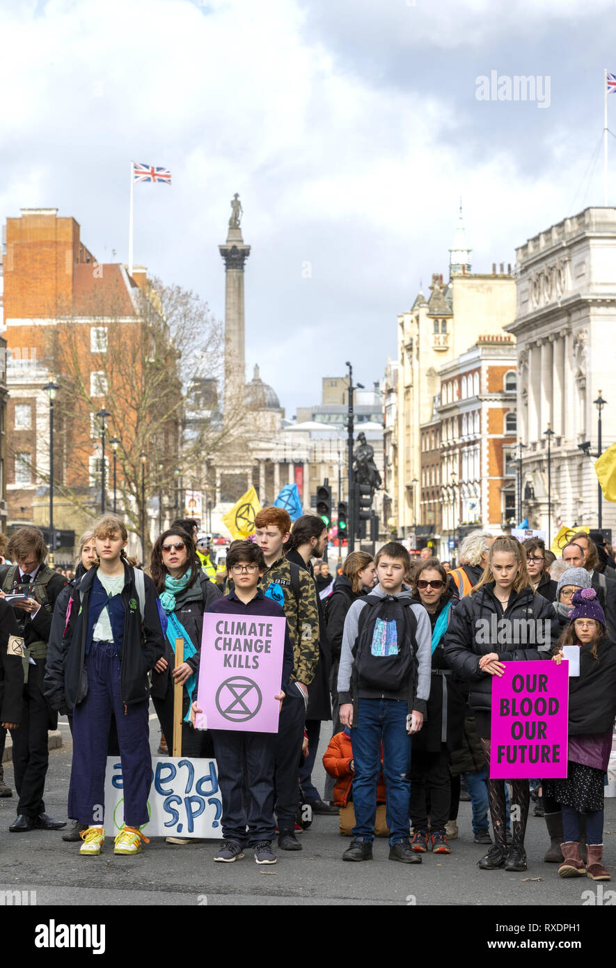 London, UK. 9th Mar, 2019. Extinction Rebellion Rally a demonstration at Downing Street. Children and teenagers with banners 'Our Blood Our Future'. Credit: AndKa/Alamy Live News Stock Photo