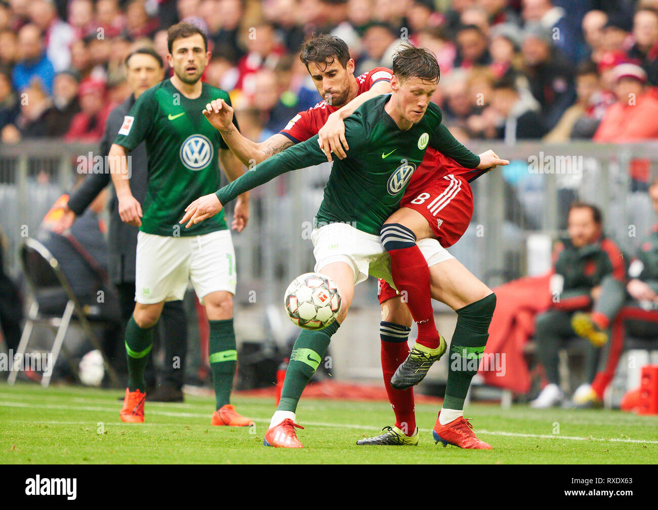 Munich, Germany. 09th Mar, 2019. Javi MARTINEZ, FCB 8 compete for the ball, tackling, duel, header, action, fight against Wout WEGHORST, WOB 9 Admir MEHMEDI, WOB 14 FC BAYERN MUNICH - VFL WOLFSBURG 6-0 - DFL REGULATIONS PROHIBIT ANY USE OF PHOTOGRAPHS as IMAGE SEQUENCES and/or QUASI-VIDEO - 1.German Soccer League, Munich, March 09, 2019 Season 2018/2019, matchday 25, FCB, München, Credit: Peter Schatz/Alamy Live News Stock Photo