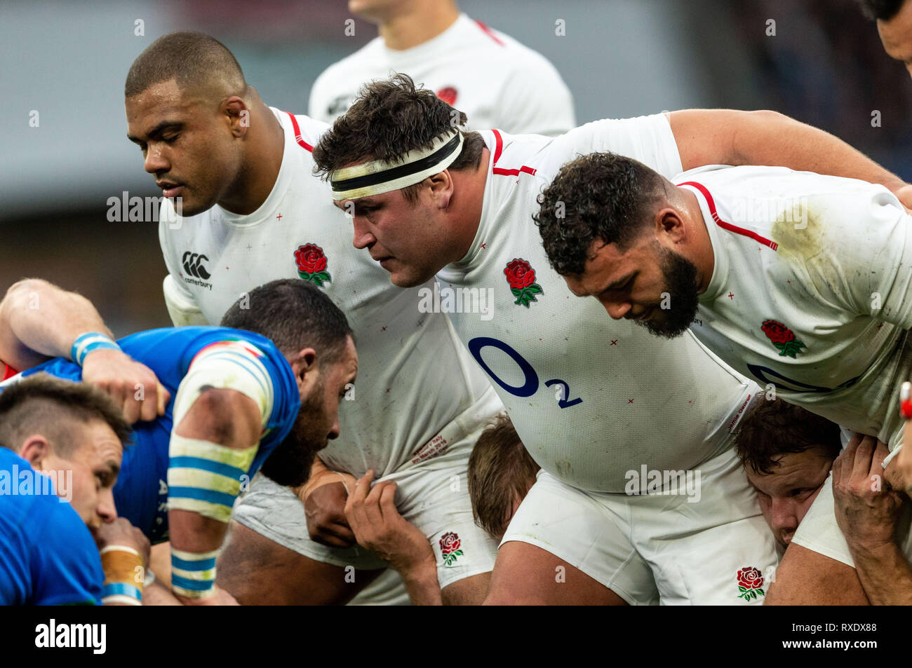 Twickenham, London, UK. 9th March 2019. 09/03/2019 England's front row of  Ellis Genge of England, Jamie George of England and Kyle Sinckler of  England get ready to scrum down during the Guinness