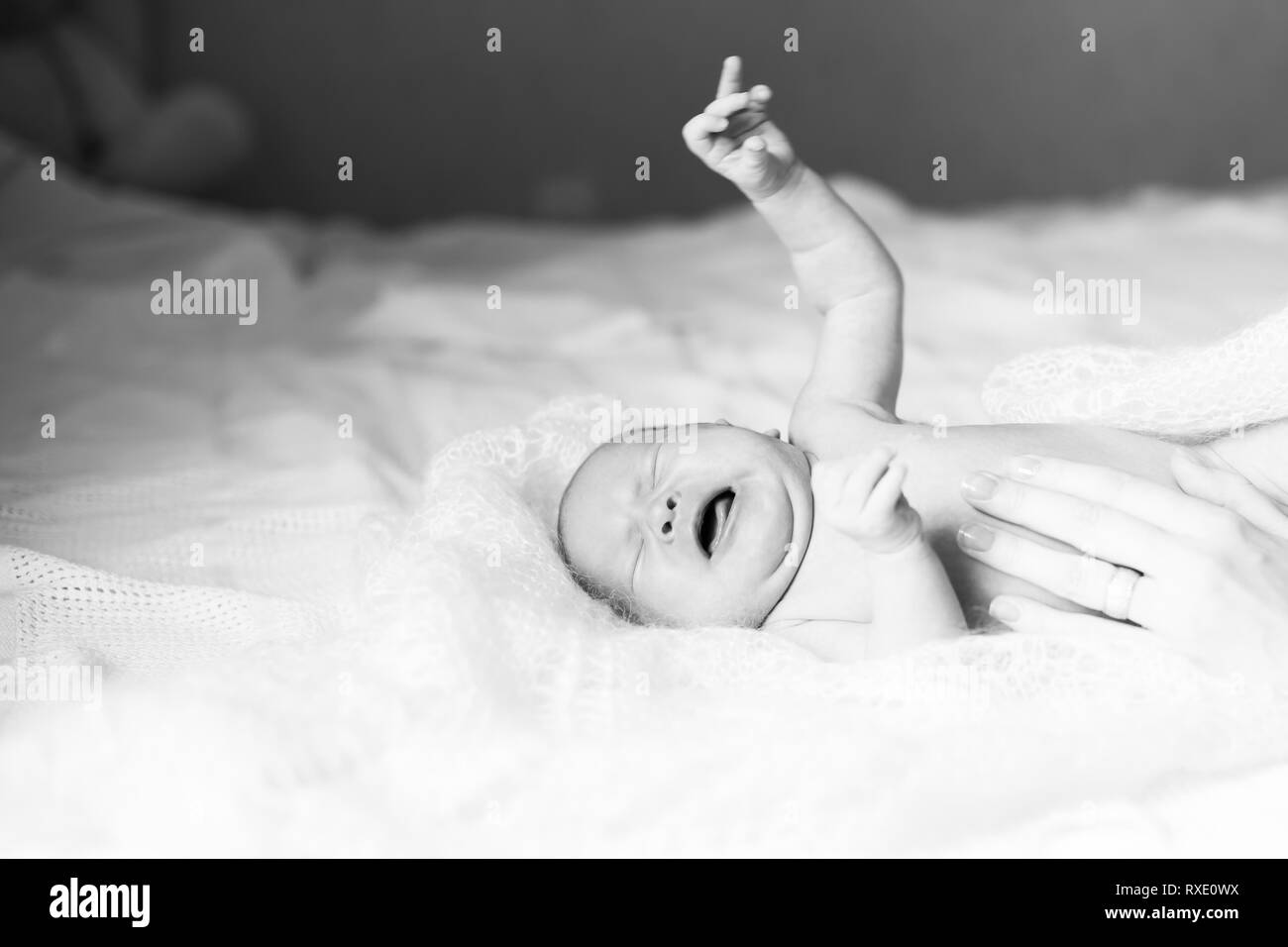 black and white image of a crying newborn baby Stock Photo