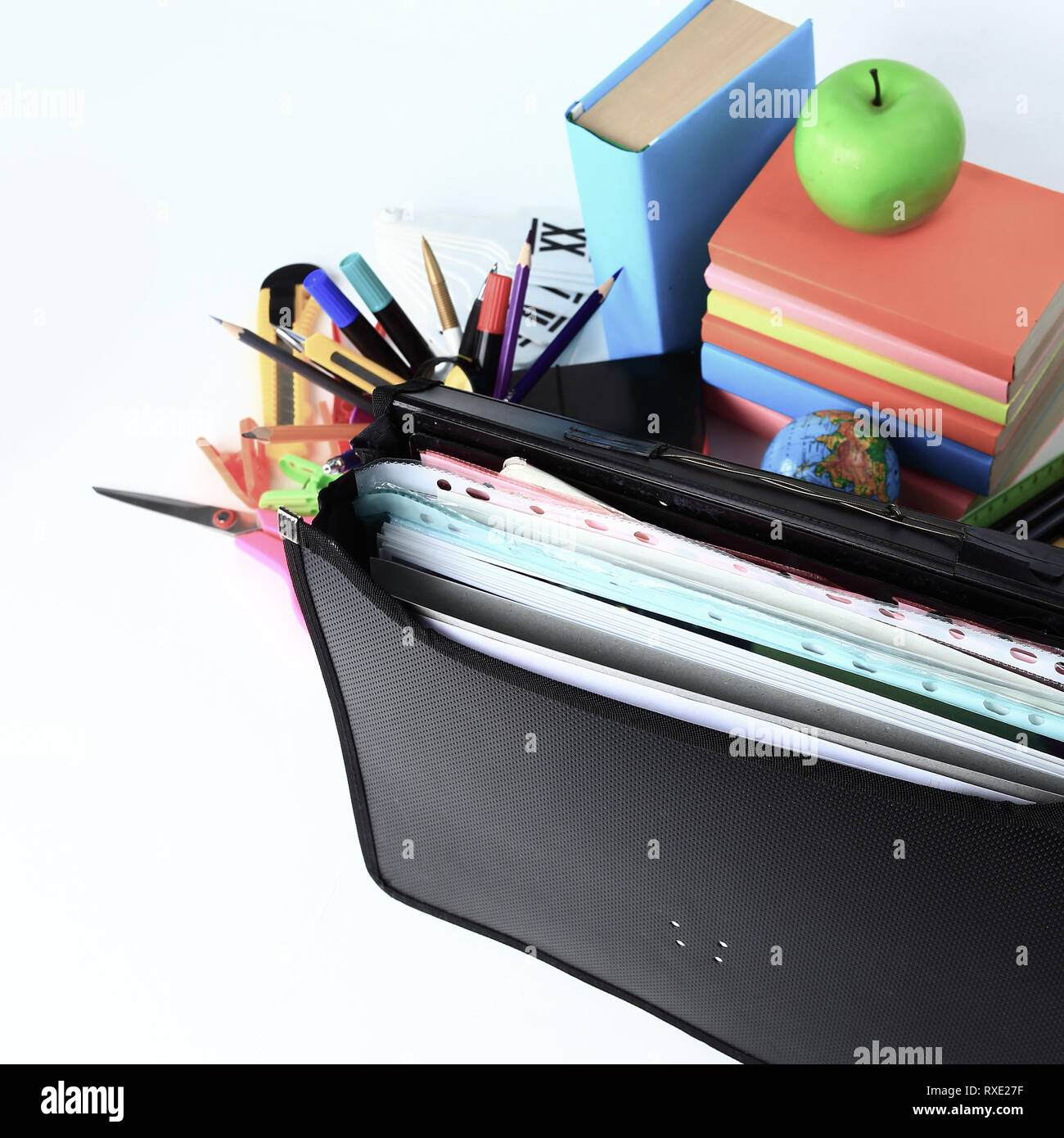 close up. briefcase, hourglass and school supplies on white background Stock Photo