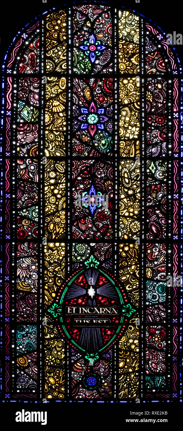 Jewel-like window symbolising the Incarnation, St. Oswald & St. Edmund Church, Ashton-in-Makerfield, Greater Manchester, UK Stock Photo