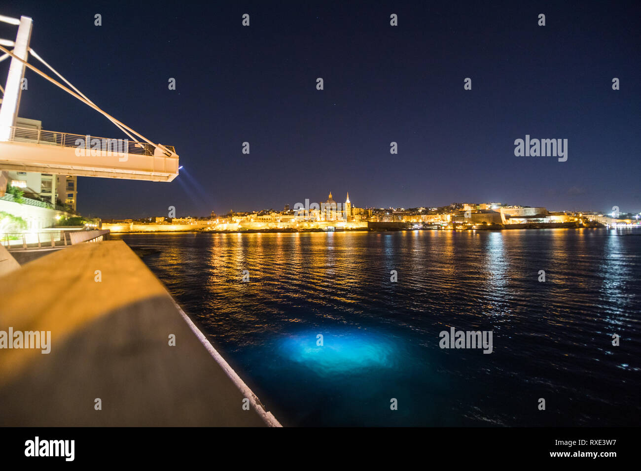View to Valetta city historical buildings from Sliema district at night, Malta. Stock Photo