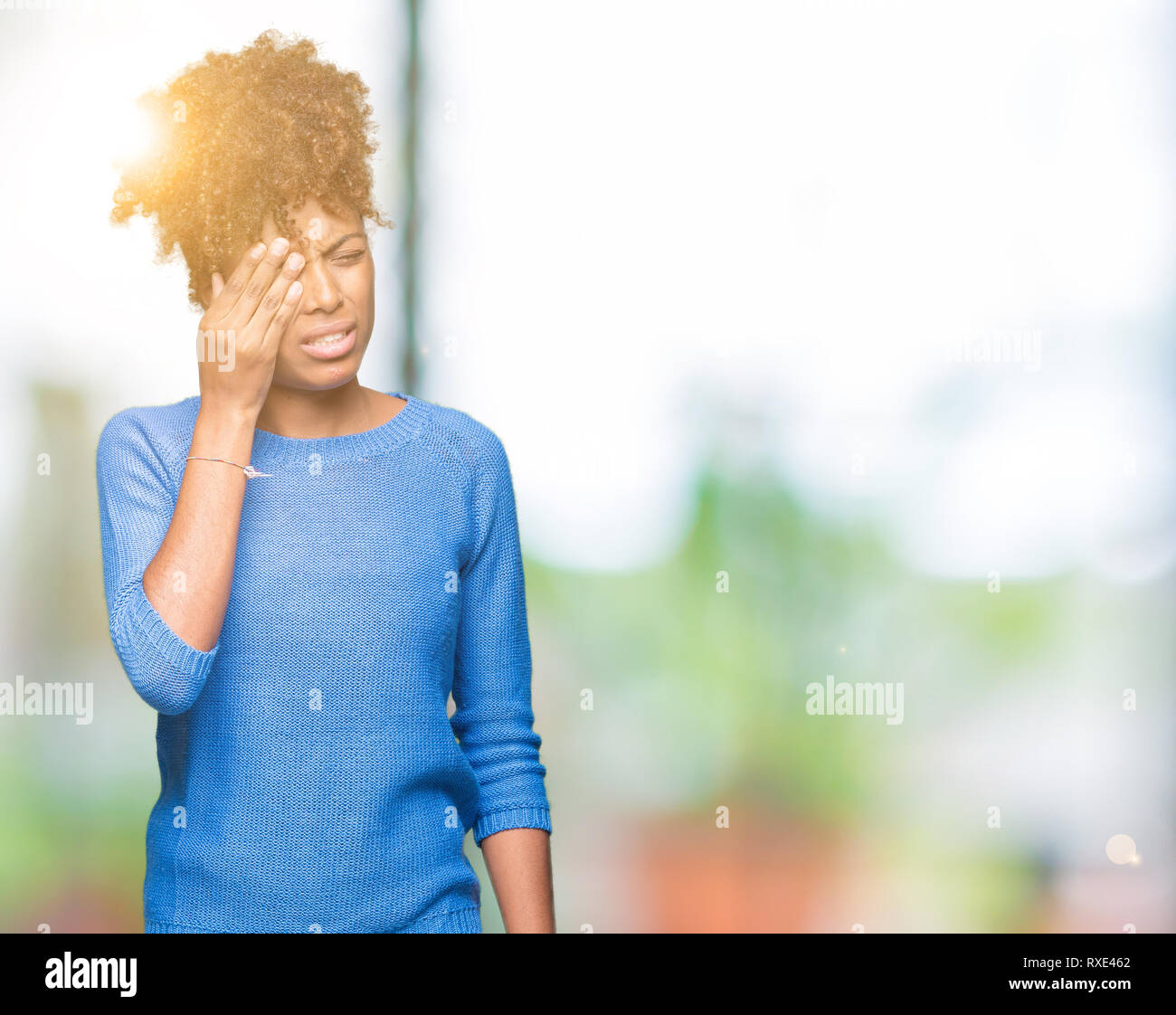 Beautiful young african american woman over isolated background Yawning