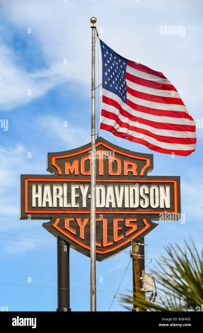 LAS VEGAS, NV, USA - FEBRUARY 2019: Sign outside a motorcycle dealership in Las Vegas with a large American flag. Stock Photo