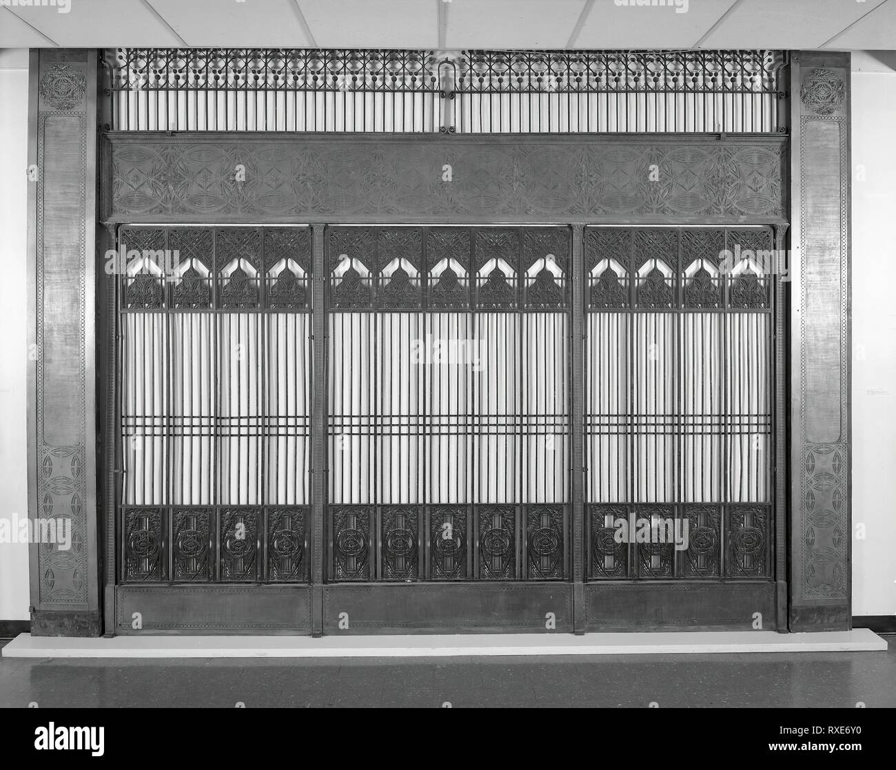 Chicago Stock Exchange: Bank of Five Elevator Grilles with Four Plates. Louis H. Sullivan; American, 1856-1924. Date: 1894. Dimensions: a)1 grill: 73 7/8 × 50 3/8 in. (o.h. × o.w.)  b-c) 2 grilles: 45 3/4 × 84 in. (o.h. × o.w.)  d-e) 2 grilles: 70 1/4 × 18 in. (o.w. × o.l.)  f) plate: 18 × 140 1/4 in. (o.w. × o.l.)   g) plate: 10 1/4 × 51 3/4 in. (o.w. × o.l.)   h) plate: 119 3/4 × 13 in.   i) plate: 119 3/4 × 14 in. Cast iron, wrought iron, and copper-plated cast iron. Origin: United States. Museum: The Chicago Art Institute. Author: Louis H. Sullivan. Architects Adler & Sullivan. Stock Photo