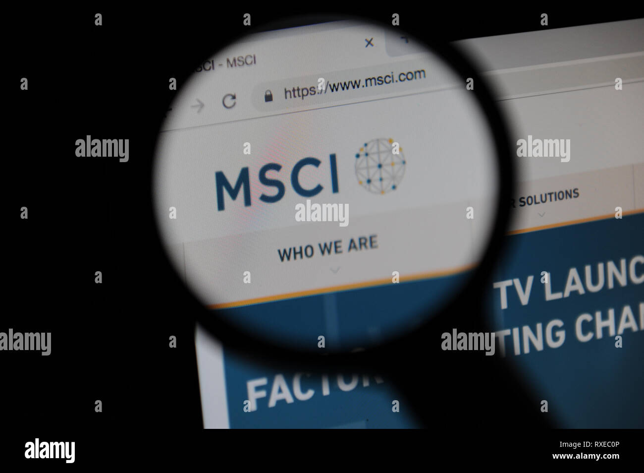 MSCI Inc website seen through a magnifying glass Stock Photo