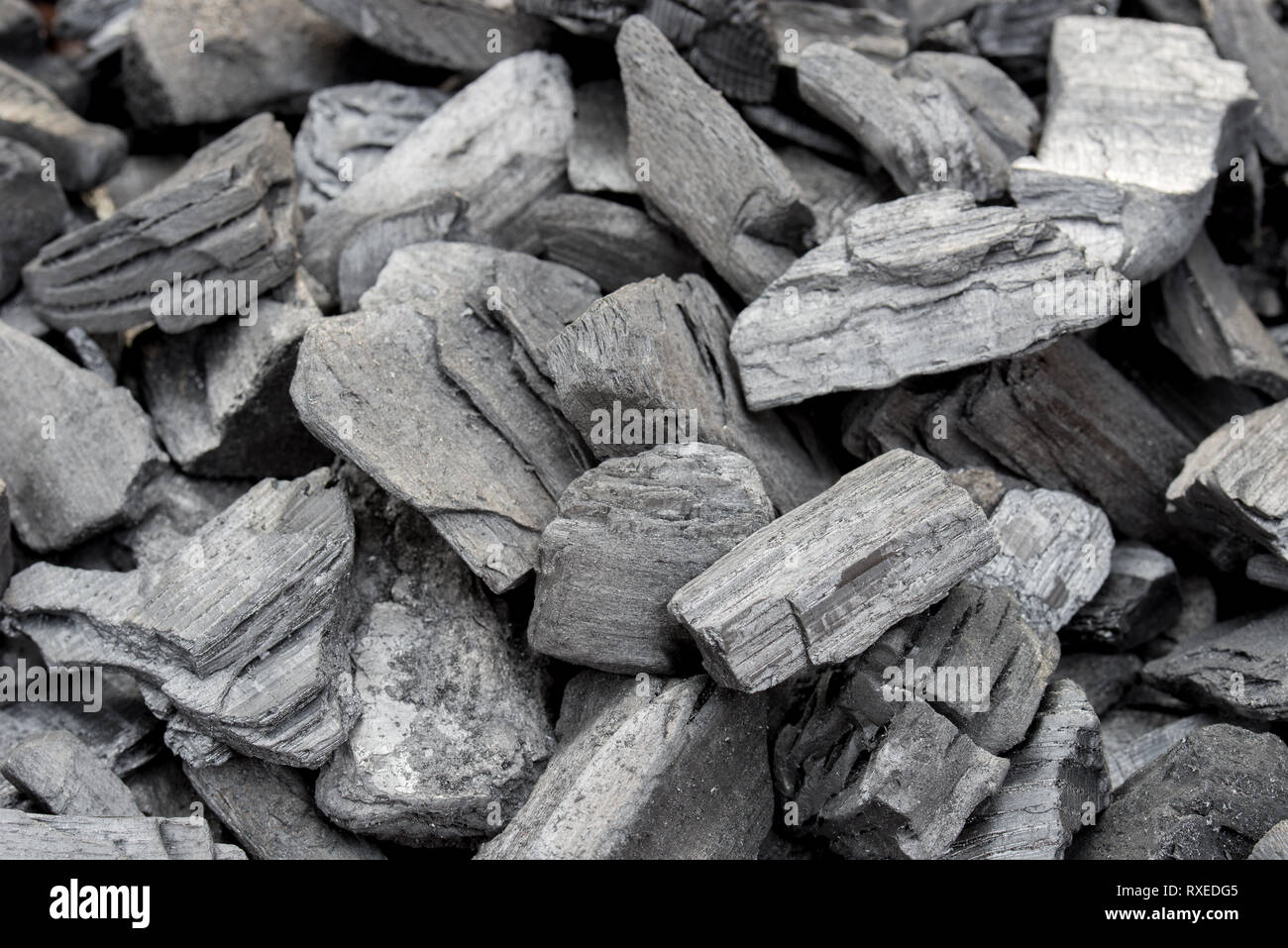 black charcoal pile texture background selective focus Stock Photo