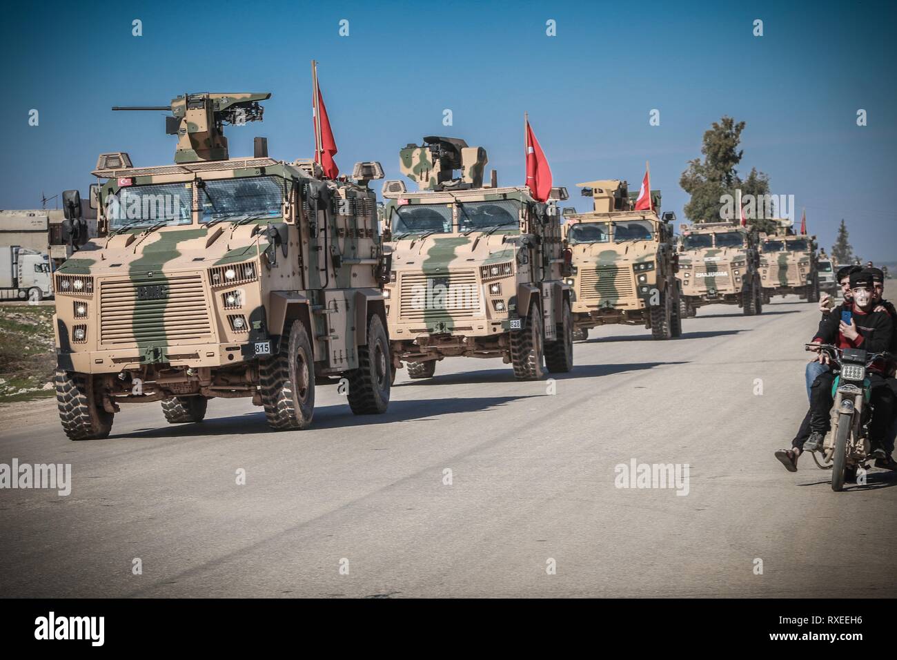 Fleet of armored vehicles seen during the patrol. The Turkish army begins its first patrol around the Syrian border in the demilitarized zone between the control points with a number of armored vehicles. Stock Photo