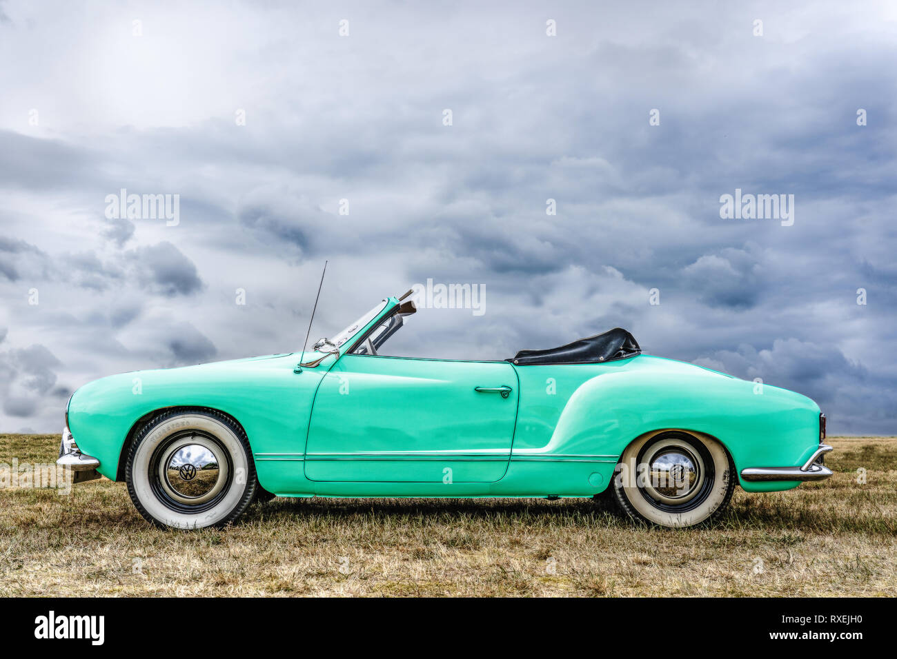 BOSSCHENHOOFD/NETHERLANDS-JUNE 11, 2018: side view of a mint green classic volkswagen kamann ghia convertible at a classic car meeting Stock Photo