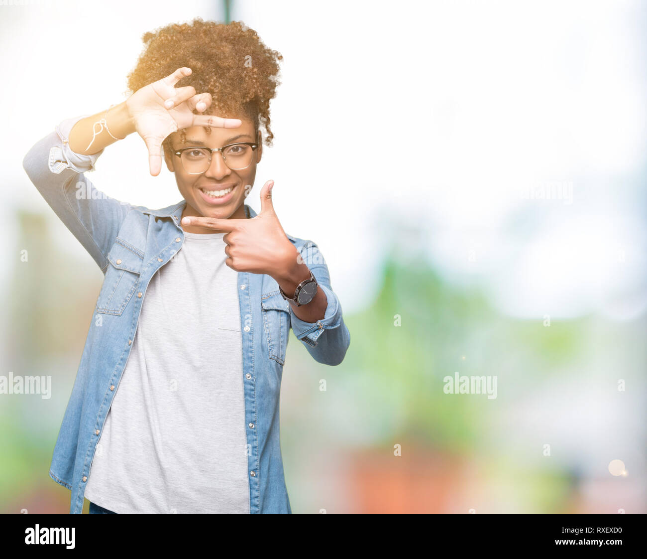 Beautiful young african american woman wearing glasses over isolated ...