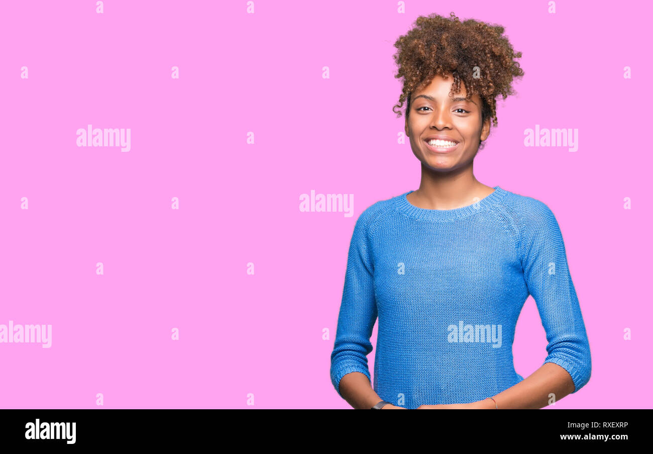 Beautiful young african american woman over isolated background Hands ...