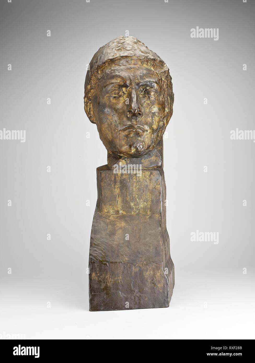 Head of Apollo. Emile-Antoine Bourdelle; French, 1861-1929. Date: 1900. Dimensions: 67.2 × 21.3 × 30.5 cm (26 1/2 × 8 3/8 × 12 in.). Bronze. Origin: France. Museum: The Chicago Art Institute. Stock Photo