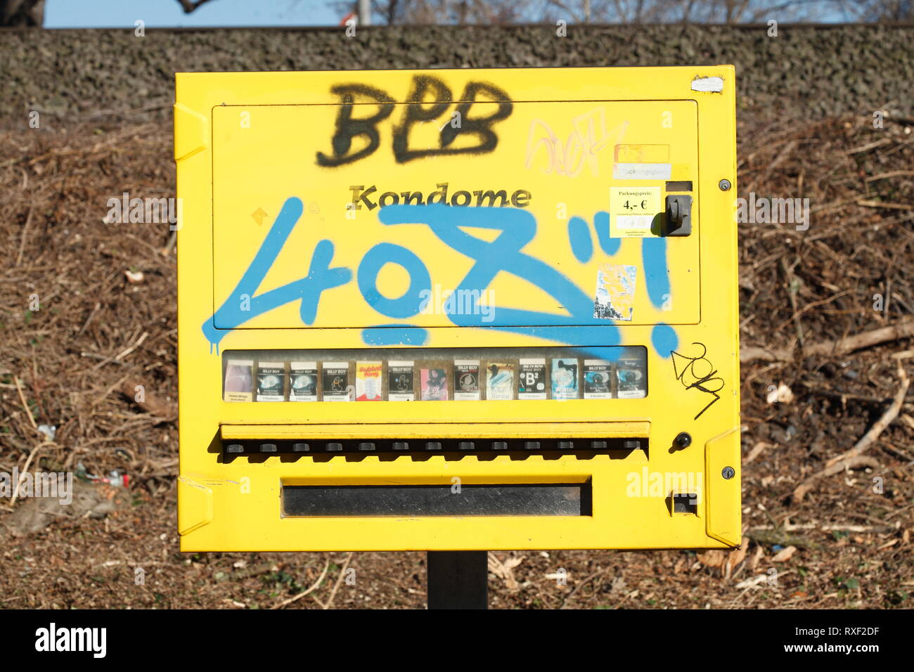 Yellow smudged old condom automaton, condomat Stock Photo - Alamy