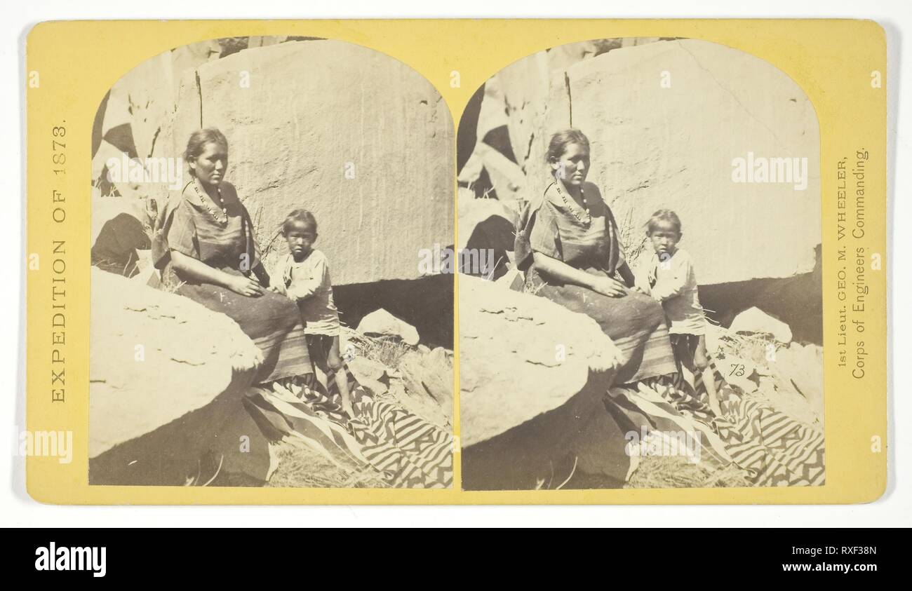 Navajo Indian Squaw, and Child, at their home, in Cañon de Chelle. Timothy O'Sullivan (American, born Ireland, 1840-1882); commissioned by George Wheeler for the War Department, Corps of Engineers, U.S. Army. Date: 1873. Dimensions: 9.2 x 7.4 cm (each image); 10 x 17.7 cm (card). Albumen print, stereo, No. 27 from the series 'Geographical Explorations and Surveys West of the 100th Meridian'. Origin: United States. Museum: The Chicago Art Institute. Stock Photo