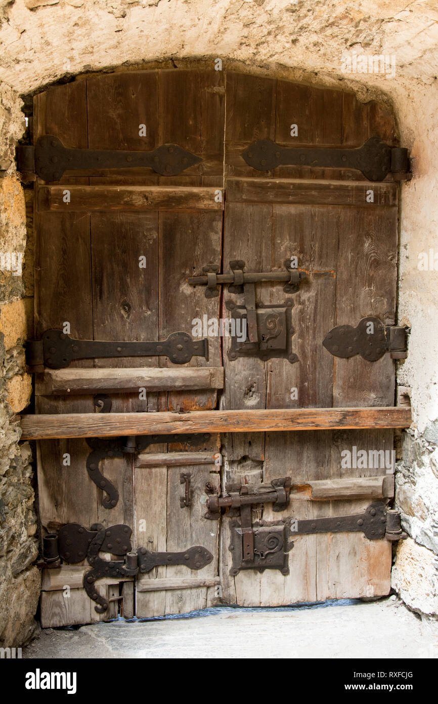 Door at Churburg or in Italian, Castel Coira is a high medieval castle in the municipality Schluderns in the Vinschgau in South Tyrol, Italy Stock Photo