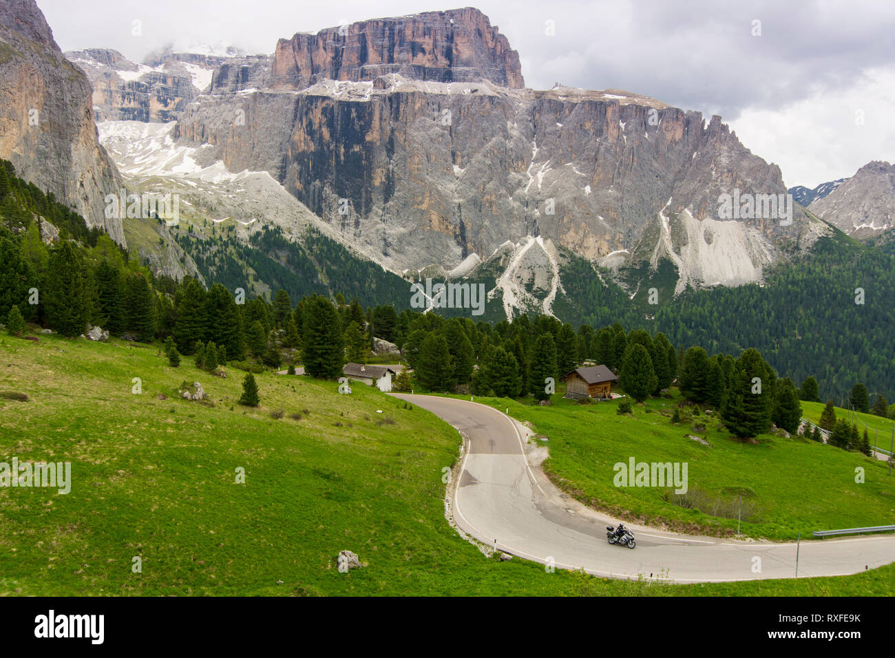 Motorcyclist in Dolomites, Italy Stock Photo